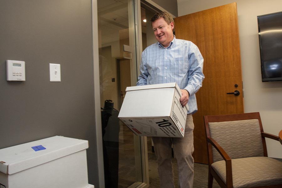 Dean of Admission Paul Steenis moves into a new office in Knox College's Alumni Hall.