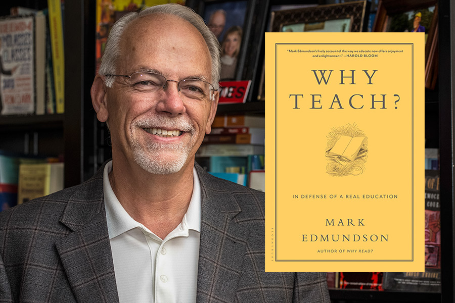 Joel Estes smiles next to the book Why Teach? 