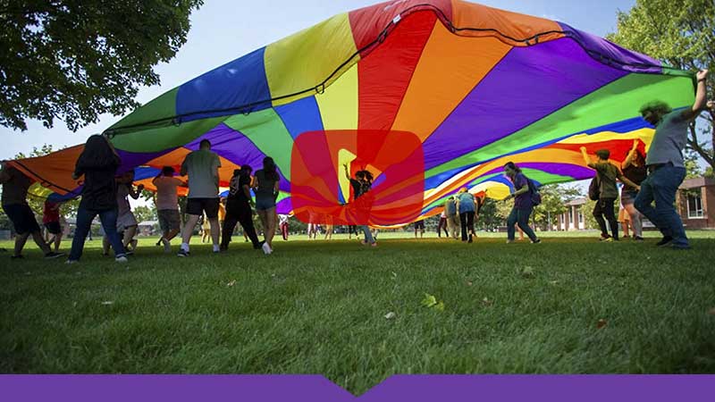 Watch the video: International students dash beneath a giant rainbow-colored parachute as part of new student orientation for the Class of 2023.