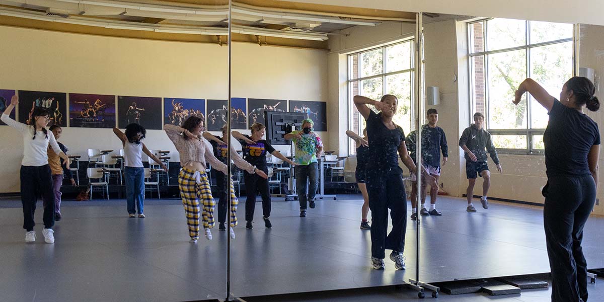 Students participating in a dance stepping workshop.