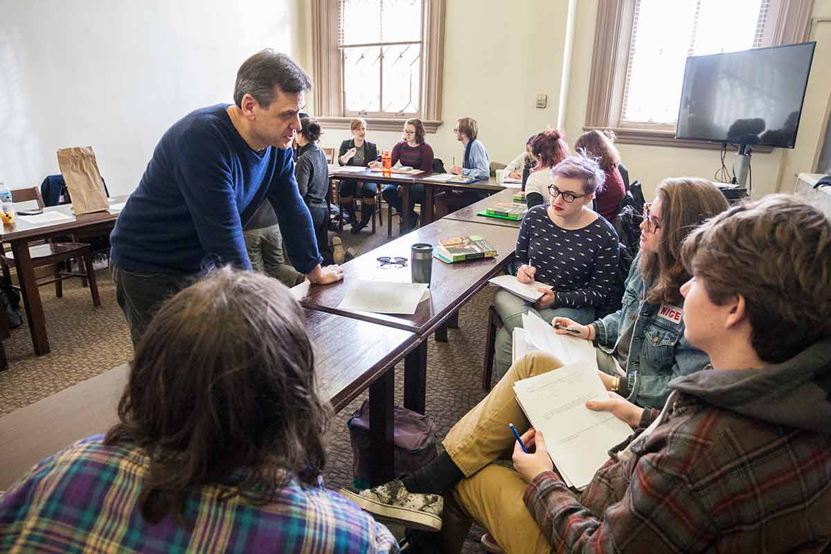 English faculty Rob Smith, with students in class in American Literature.