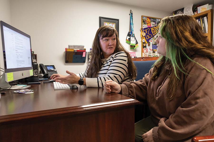 Executive Director of TRIO & McNair Programs Risa Lopez speaks with Gabriel Randol ’25 in her TRIO office found in the Center for Teaching and Learning.