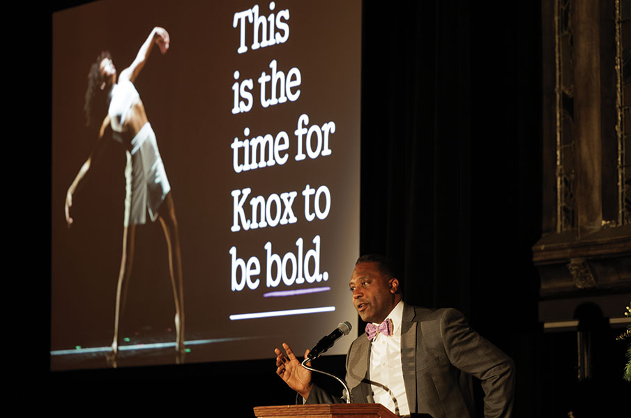 President C. Andrew McGadney stands in front of a slide presentation during Venture Boldly in Chicago. 