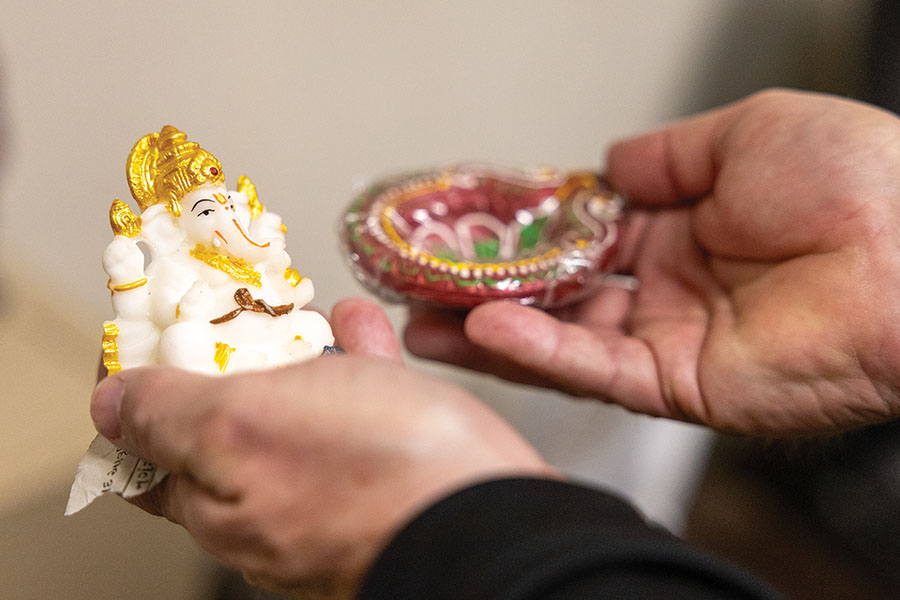 Jeff Gomer holding an idol of Lord Ganesha from India.