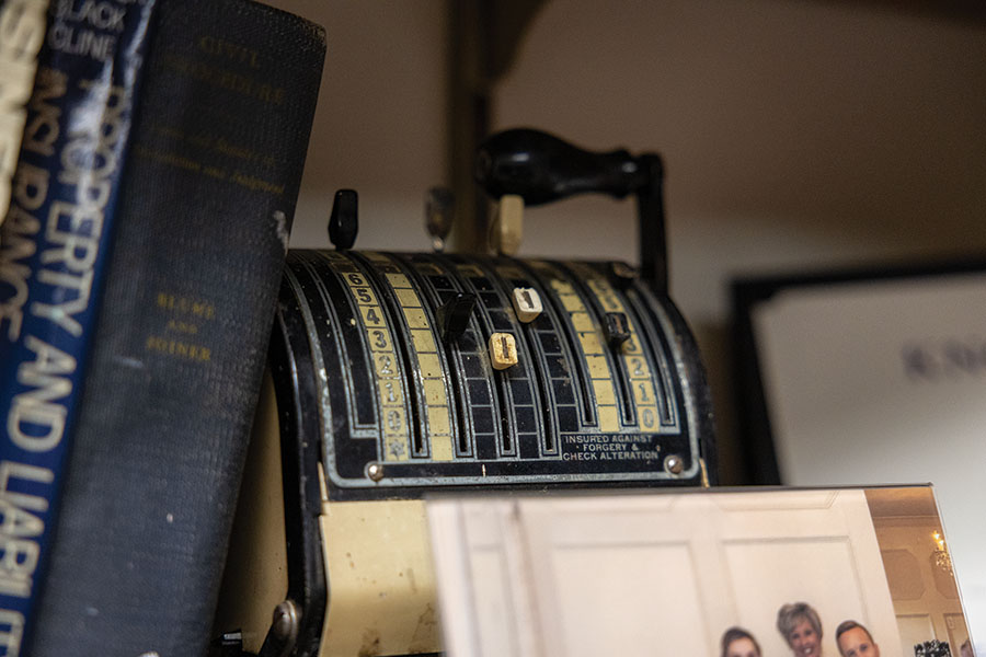 An old check writer sitting on a shelves in Jeff's office.