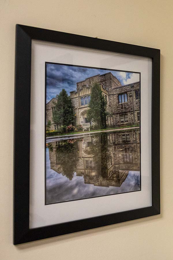 A photo of Seymour Library hanging on the wall in a black frame.