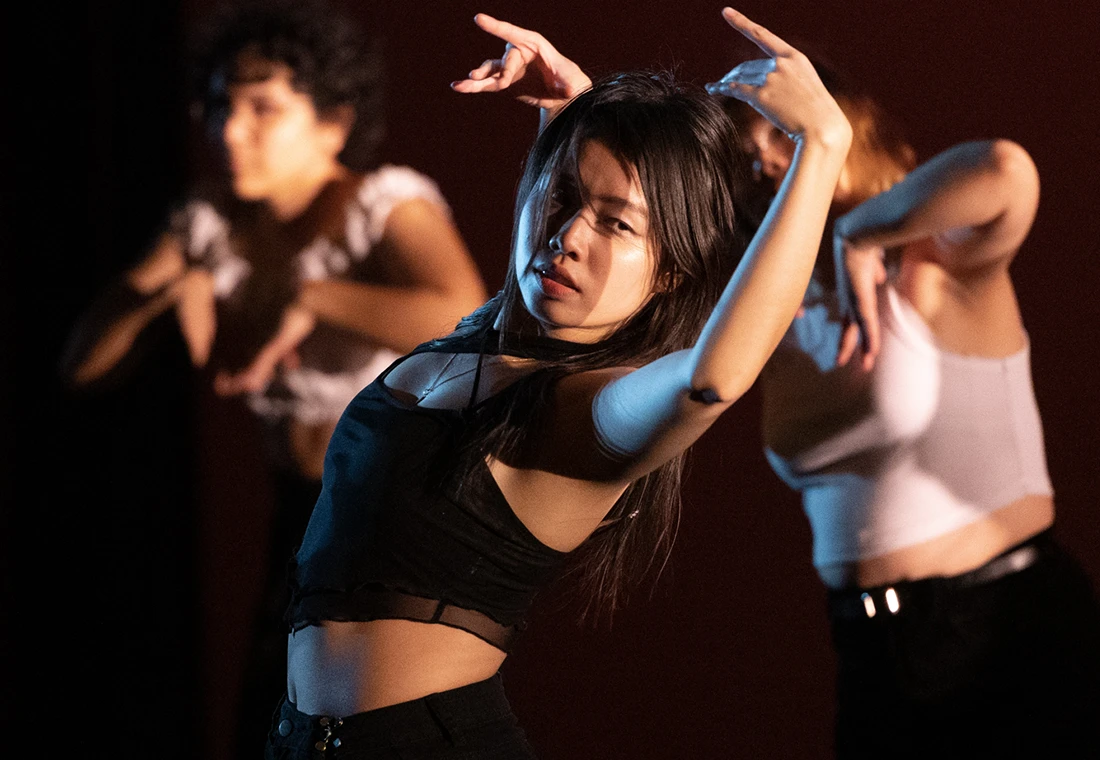 Students perform a dance.