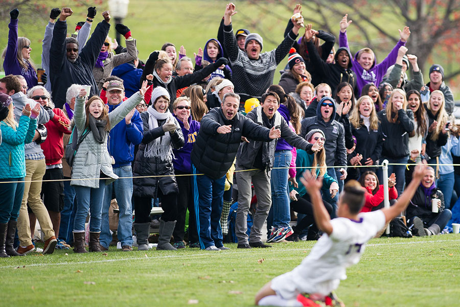 Knox College men's soccer player Shu Kitamura celebrates scoring the winning goal.