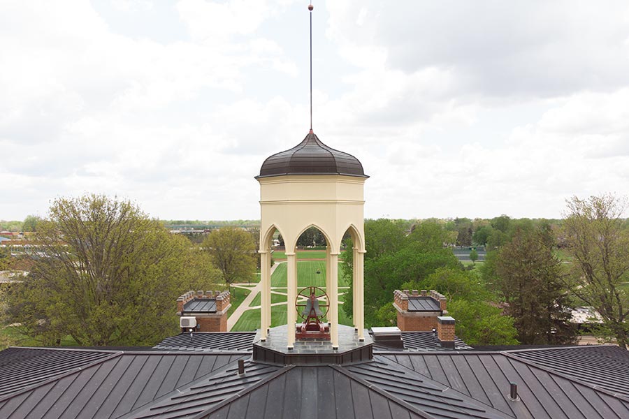 An up-close view of the bell tower atop Old Main