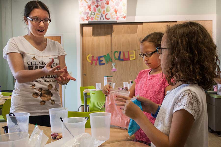 A student in the Chemistry Club conducta activities for kids at the Discovery Depot Children's Museum in Galesburg.