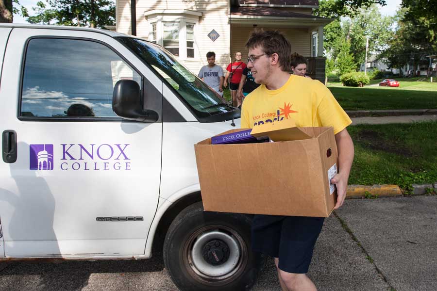 Knox College students collecting items from residence halls for reuse and recycling.
